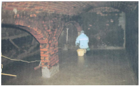 Figure 24: Cleaning inside the vaulted brick reservoir